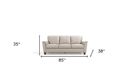 85" Beige Leather Sofa With Black Legs